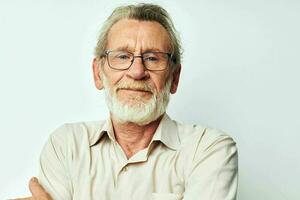 Portrait of happy senior man with a gray beard in a shirt and glasses isolated background photo