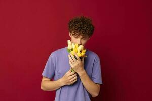 cute teen red hair in casual wear bouquet of flowers gift red background unaltered photo