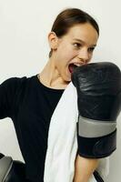 athletic woman in black sports uniform boxing gloves towel fitness training photo