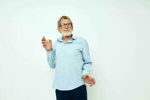 Senior grey-haired man in shirt and glasses posing emotions isolated background photo