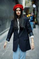 Fashion woman portrait walking tourist in stylish clothes with red lips walking down narrow city street, travel, cinematic color, retro vintage style, dramatic look without smile sadness. photo