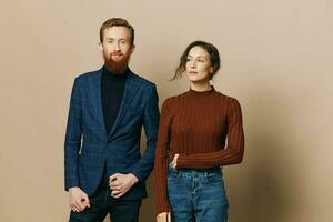 Man and woman couple in a relationship smile and interaction on a beige background in a real relationship between people photo