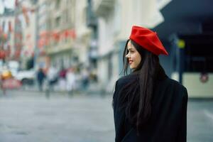 Woman smile walks walks in the city against the backdrop of office buildings, stylish fashionable vintage clothes and make-up, spring walk, travel. photo