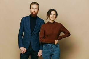 Man and woman couple in a relationship smile and interaction on a beige background in a real relationship between people photo