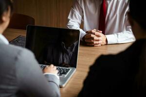 Image of employer or recruiter holding reading a resume during about colloquy his profile of candidate. photo