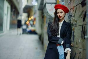 Fashion woman portrait walking tourist in stylish clothes with red lips walking down narrow city street, travel, cinematic color, retro vintage style, dramatic. photo