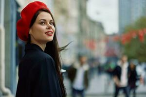 Woman smile walks walks in the city against the backdrop of office buildings, stylish fashionable vintage clothes and make-up, autumn walk, travel. photo