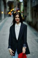 Fashion woman tourist in stylish clothes in a jacket and red beret running down the narrow street of the city smile and happiness trip, French style, cinematic color. photo