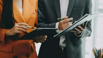 Team of business people working together in the meeting room office, teamwork background charts and graphs banner, double exposure successful teamwork,business planning concept. video