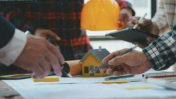 Construction and structure concept of Engineer or architect meeting for project working with partner and engineering tools on model building and blueprint in working site, contract for both companies. video
