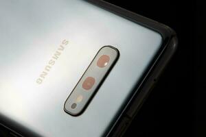 Samsung Galaxy S10e close up. Technology brand. IT and consumer electronic. Product photo. photo