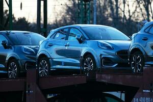 New Ford Puma ST-Line 2021. Creative sunset low light photoshoot. Part of a massive 500 car freight train. photo