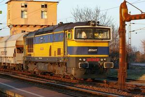 International train transportation. Cargo freight train wagon at train station. Global transport and shipping. photo