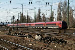 International and regional railway transportation. Passenger freight train set at station. Public transport. photo