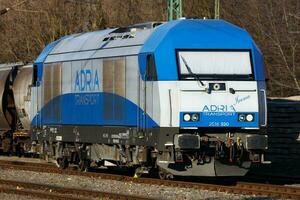 International train transportation. Locomotive train at station. Global railway transport and shipping. photo