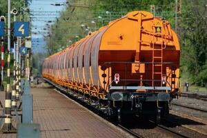 International train transportation. Cargo freight train wagon at train station. Global transport and shipping. photo