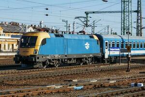 International and regional railway transportation. Passenger freight train set at station. Public transport. photo