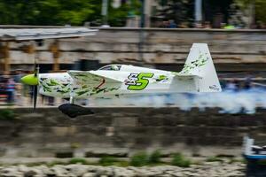 Christian Bolton flying with N22ZE Zivko Edge 540 flying over Danube River at Budapest downtown for Red Bull Air Race 2018 photo