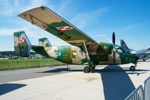 Military transport plane at air base. Air force flight operation. Aviation and aircraft. Air lift. Military industry. Fly and flying. photo