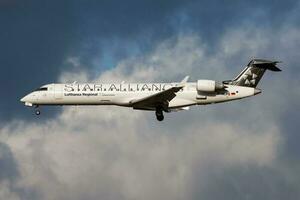 Star Alliance Lufthansa Bombardier CRJ-700 D-ACPS passenger plane landing at Frankfurt Airport photo