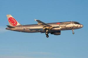 FlyNiki Airbus A320 OE-LEB passenger plane landing at Frankfurt Airport photo