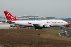 Air Cargo Germany Boeing 747-400 D-ACGA cargo plane taxiing at Frankfurt Airport photo