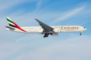Emirates Airlines Boeing 777-300ER A6-ECE passenger plane landing at Frankfurt Airport photo