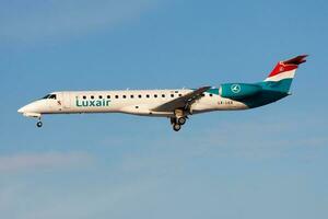 Luxair Embraer ERJ-145 LX-LGX passenger plane landing at Frankfurt Airport photo