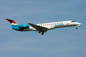 Luxair Embraer ERJ-145 LX-LGJ passenger plane landing at Frankfurt Airport photo