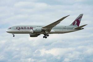 Qatar Airways passenger plane at airport. Schedule flight travel. Aviation and aircraft. Air transport. Global international transportation. Fly and flying. photo