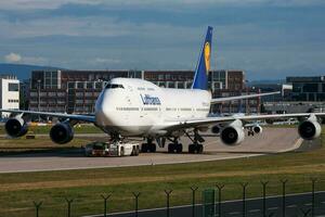 Lufthansa passenger plane at airport. Schedule flight travel. Aviation and aircraft. Air transport. Global international transportation. Fly and flying. photo