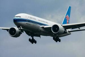 China Southern cargo plane at airport. Air freight and shipping. Aviation and aircraft. Transport industry. Global international transportation. Fly and flying. photo