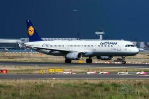 Lufthansa passenger plane at airport. Schedule flight travel. Aviation and aircraft. Air transport. Global international transportation. Fly and flying. photo