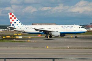 Croatia Airlines passenger plane at airport. Schedule flight travel. Aviation and aircraft. Air transport. Global international transportation. Fly and flying. photo