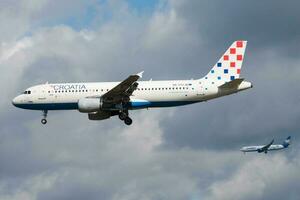 Croatia Airlines Airbus A320 9A-CTJ passenger plane parallel landing at Frankfurt airport photo