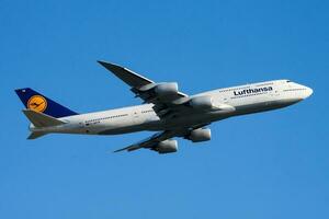 Lufthansa passenger plane at airport. Schedule flight travel. Aviation and aircraft. Air transport. Global international transportation. Fly and flying. photo