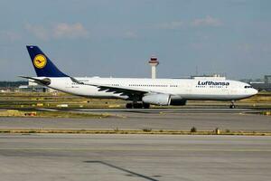 Lufthansa passenger plane at airport. Schedule flight travel. Aviation and aircraft. Air transport. Global international transportation. Fly and flying. photo