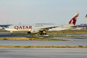 Qatar cargo plane at airport. Air freight shipping. Aviation and aircraft. Air transport. Global international transportation. Fly and flying. photo