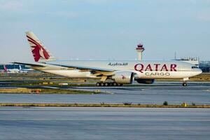 Qatar cargo plane at airport. Air freight shipping. Aviation and aircraft. Air transport. Global international transportation. Fly and flying. photo