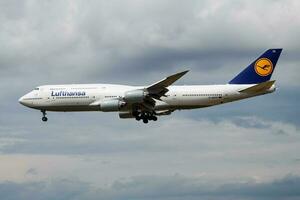 Lufthansa passenger plane at airport. Schedule flight travel. Aviation and aircraft. Air transport. Global international transportation. Fly and flying. photo