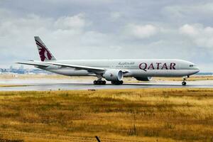 Qatar Airways passenger plane at airport. Schedule flight travel. Aviation and aircraft. Air transport. Global international transportation. Fly and flying. photo