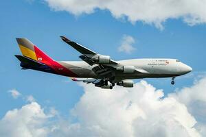 Asiana Airlines cargo plane at airport. Air freight shipping. Aviation and aircraft. Air transport. Global international transportation. Fly and flying. photo