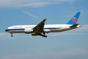 China Southern cargo plane at airport. Air freight shipping. Aviation and aircraft. Air transport. Global international transportation. Fly and flying. photo