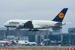 Lufthansa passenger plane at airport. Schedule flight travel. Aviation and aircraft. Air transport. Global international transportation. Fly and flying. photo