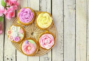 Top view of Thai colorful dessert - coconut milk jelly in variant flower shape , beautiful and delicious . Homemade cuisine photo