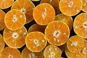 Top view of fresh half orange as background photo