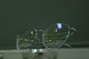Close-up of glasses, eyeglass progressive lenses photo