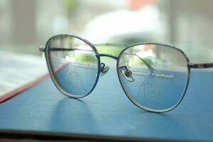 Close-up of glasses, eyeglass progressive lenses photo