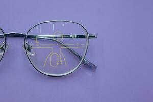 Close-up of glasses, eyeglass progressive lenses photo