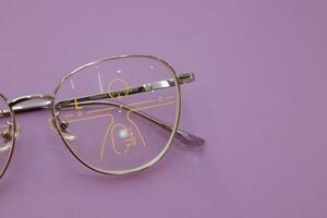 Close-up of glasses, eyeglass progressive lenses photo